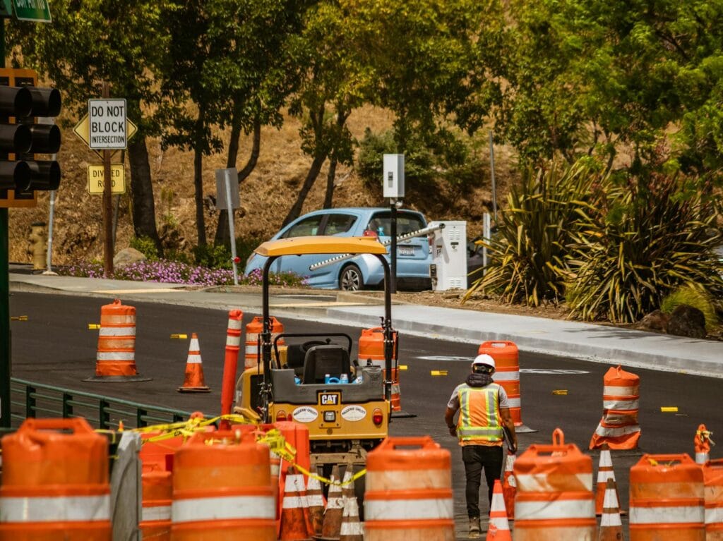 worker on asphalt during roadworks